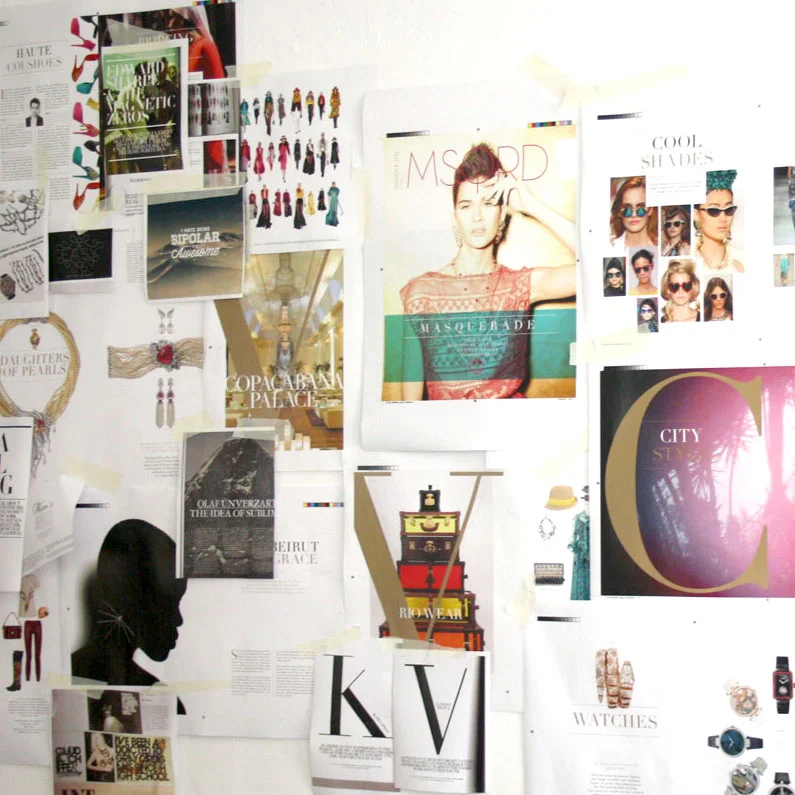 the wall of spread ideas and intitial designs for Masquerade Magazine