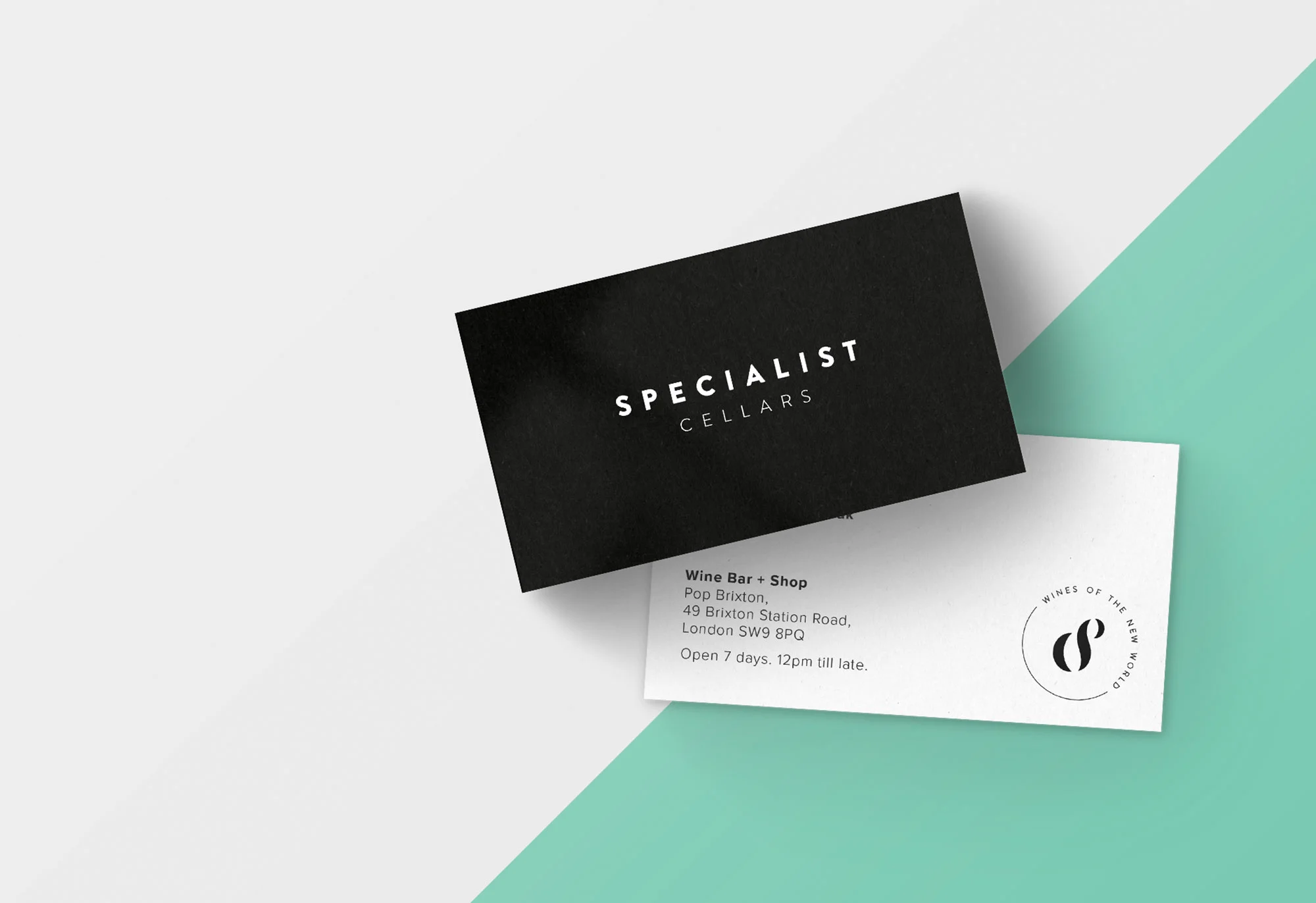 the Specialist Cellars business cards white logotype on a black background with a bold green graphic background